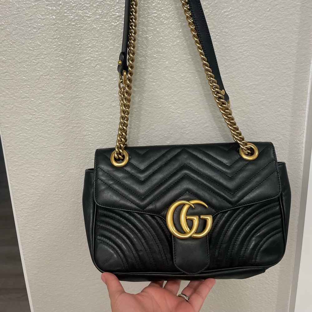 Black with gold.Small Gucci marmont shoulder bag.